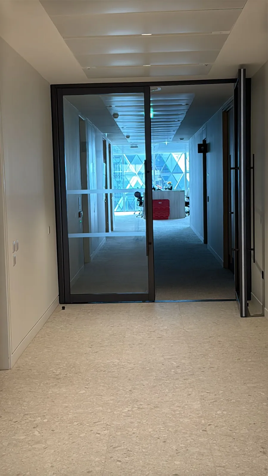 Completed bronze-framed glazed doors on a fit-out floor at 40 Leadenhall Street.