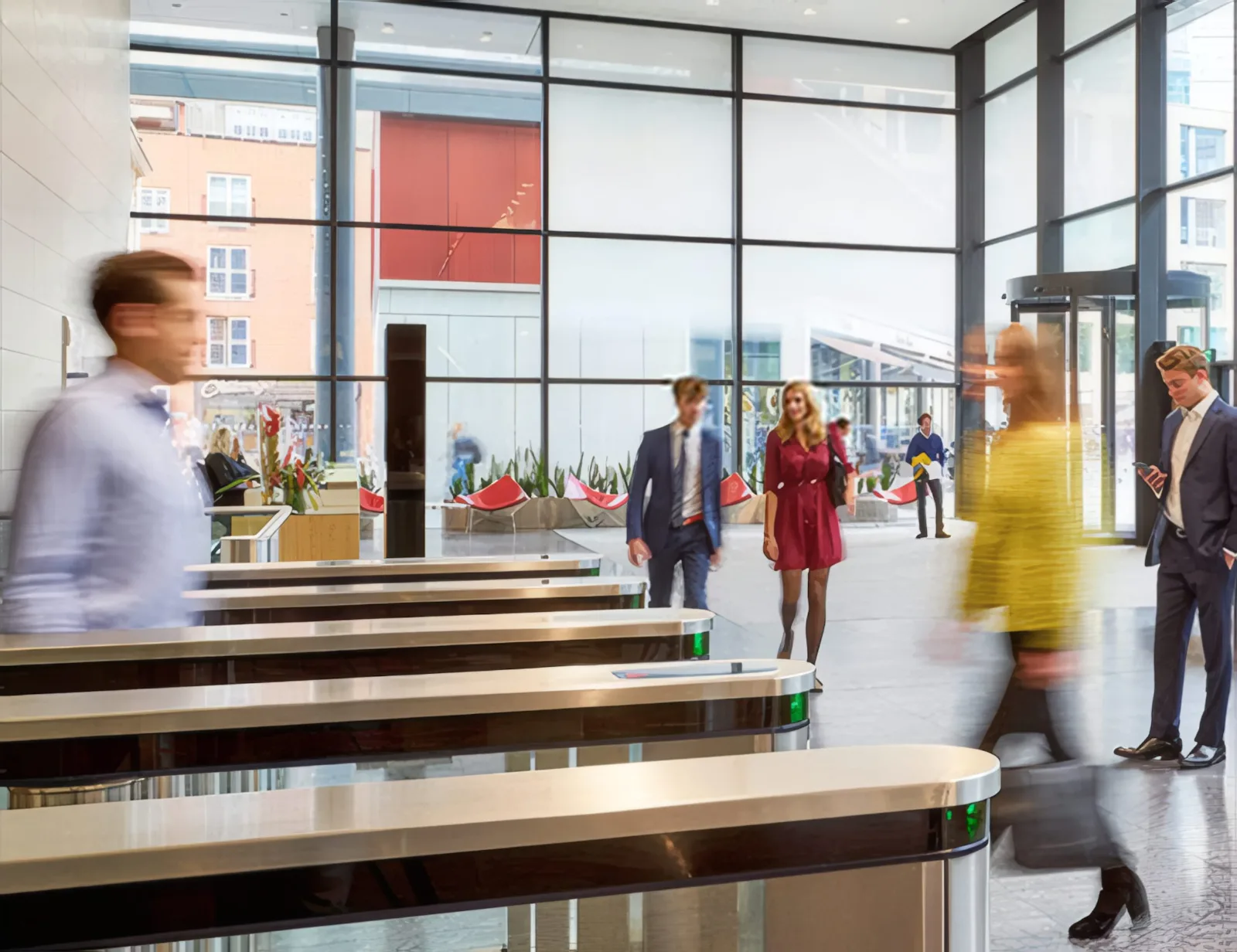 The ground-floor reception, with full-height glazing and entrance speed gates.