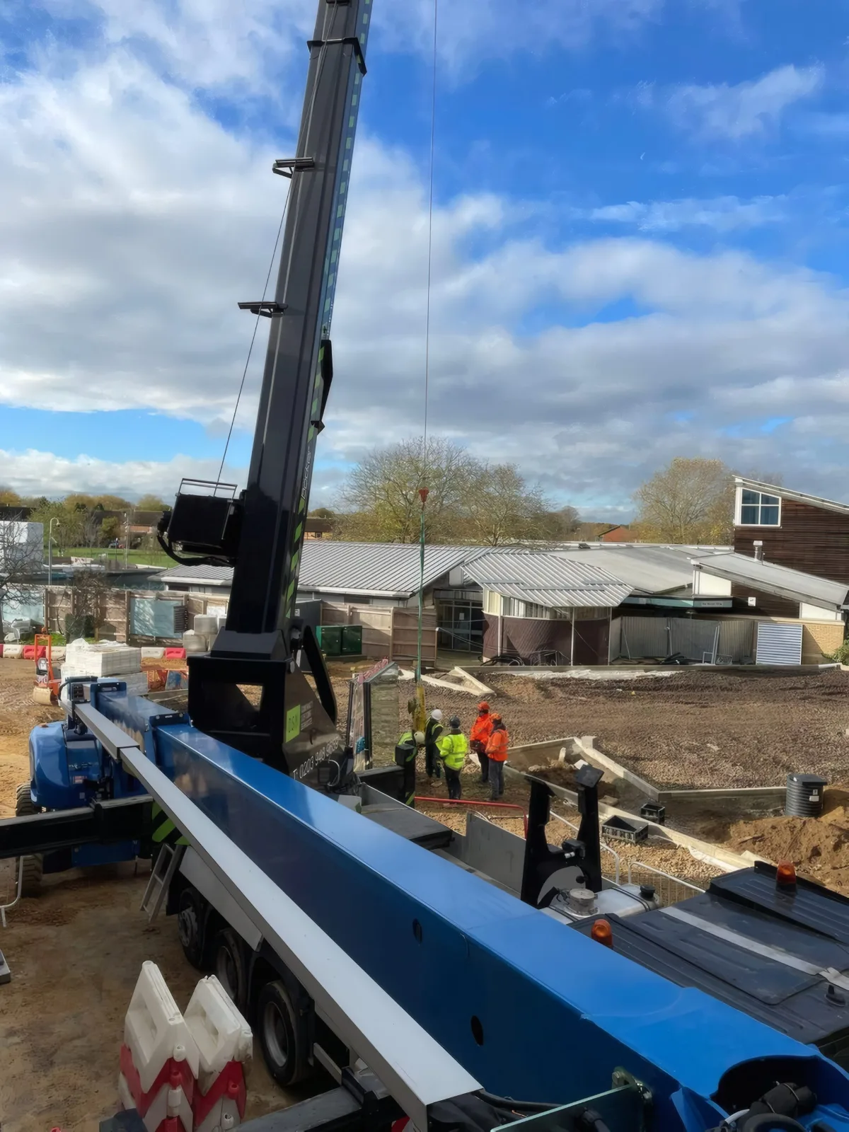The mobile crane positioned on site ahead of a glazing lift.