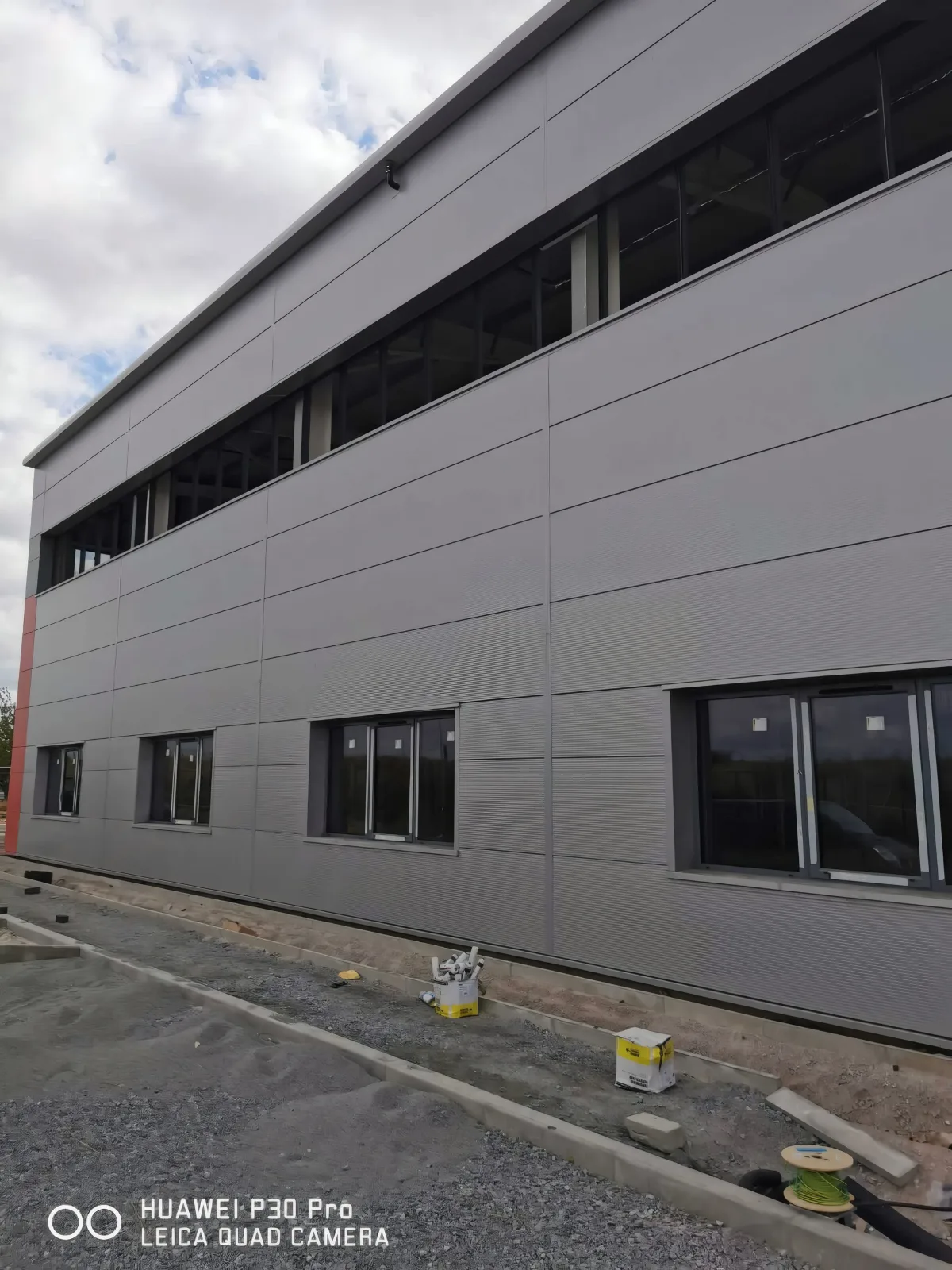 Cladding and a band of windows along the side of a unit.