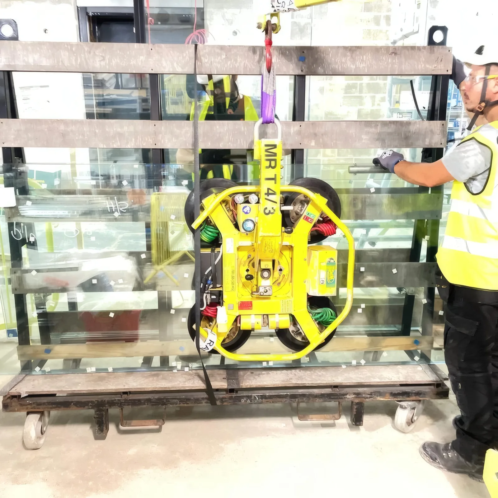 A glazing unit on a transport pallet, being prepared for lifting into position.