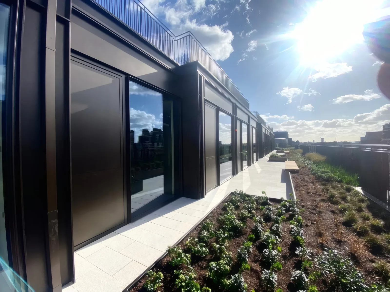Aluminium cladding and framing installed to the roof terrace pavilions.