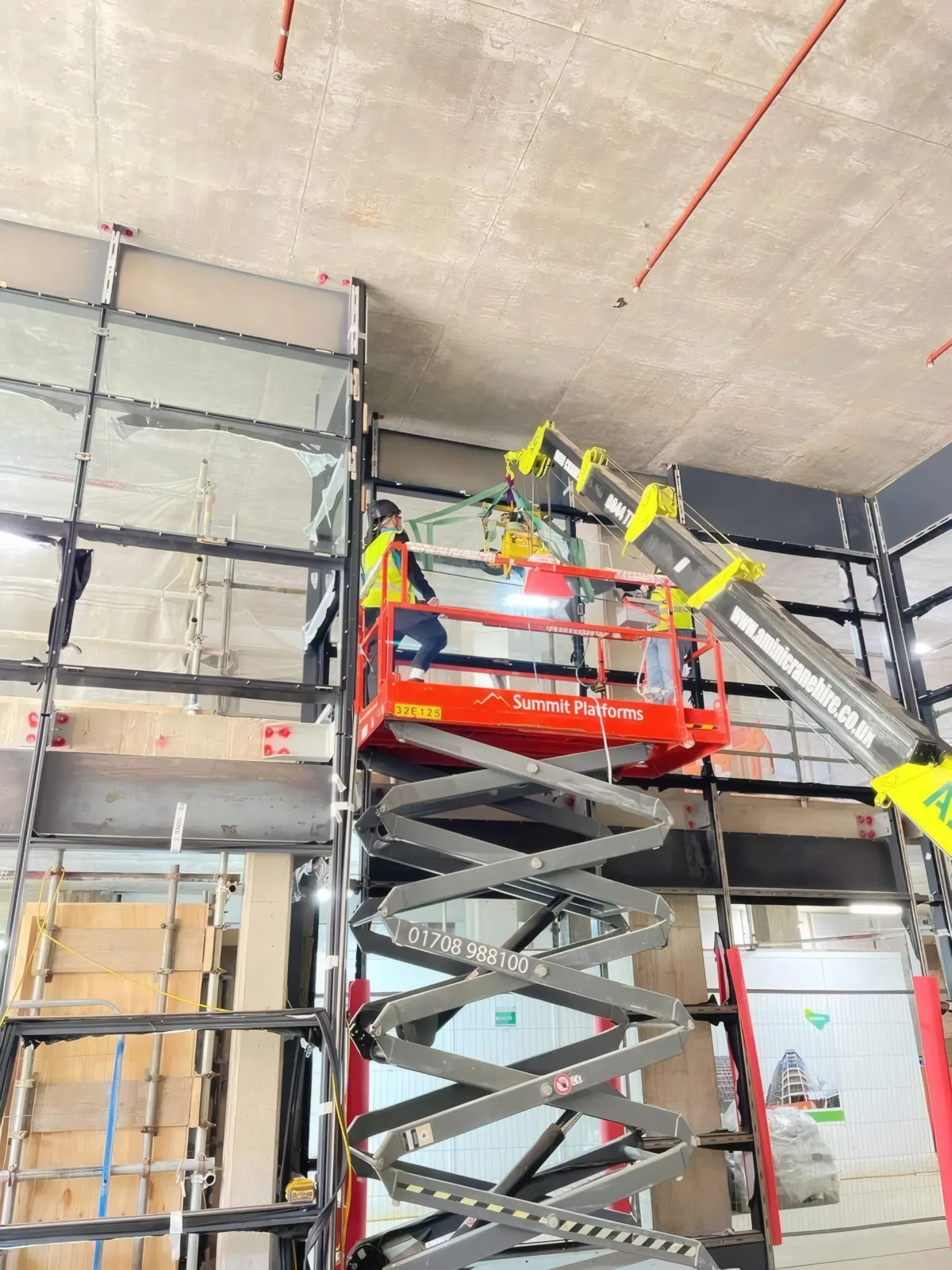 Curtain wall support steelwork at a corner junction, tied back into the concrete frame.