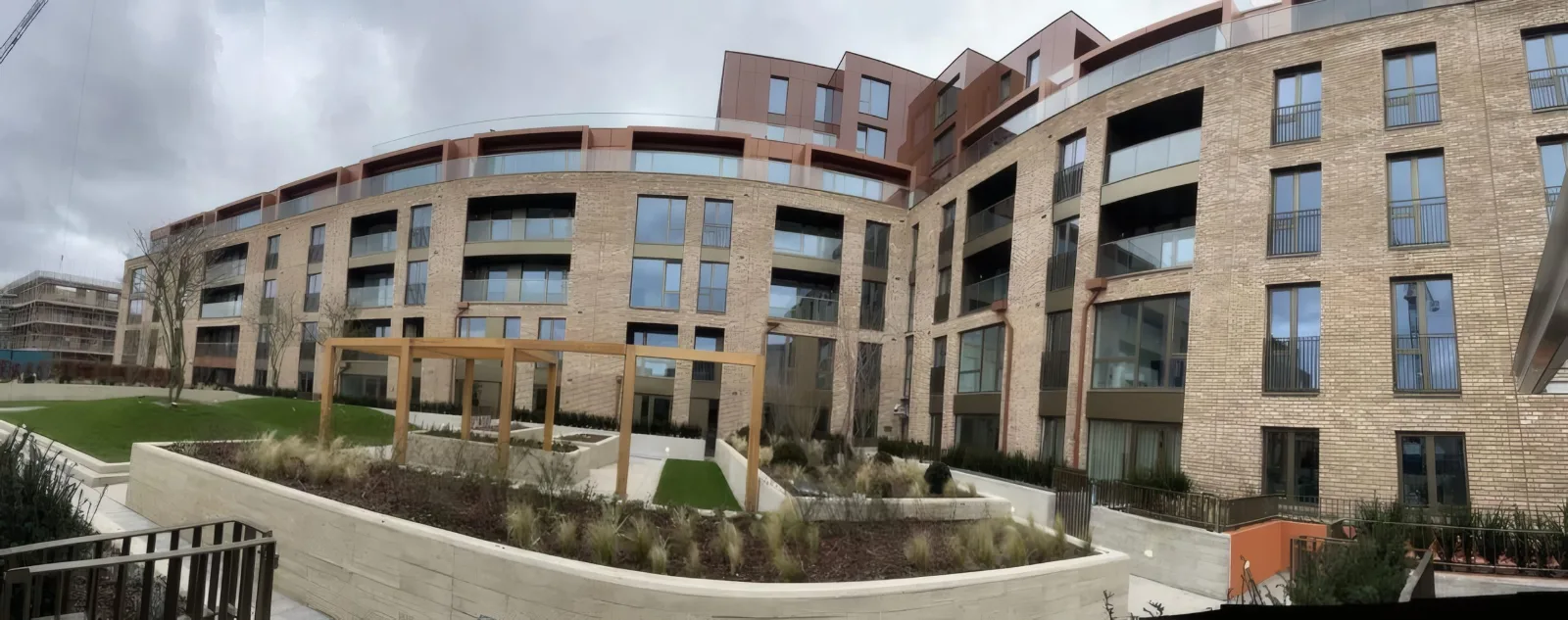 A wider view of the completed courtyard facade and landscaping.