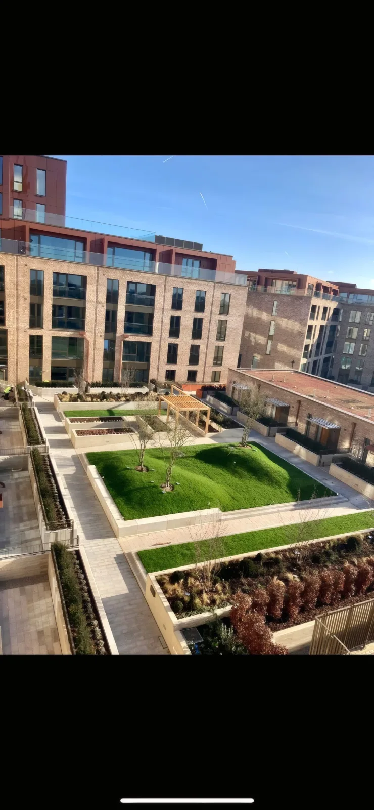 An elevated view of the landscaped courtyard gardens at the heart of the development.
